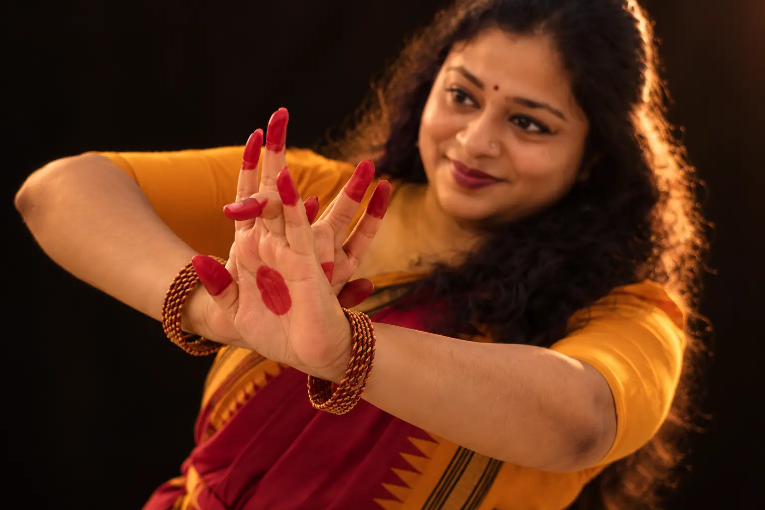 Hands in a mudra with red alta